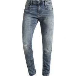 GStar REVEND Jeans Skinny Fit vintage aged destroyed. Niebieskie jeansy męskie G-Star, z bawełny, vintage. Za 609.00 zł.