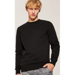Gładka bluza - Czarny. Bluzy nierozpinane męskie marki DOMYOS. W wyprzedaży za 49.99 zł.