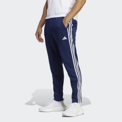 Train Essentials 3-Stripes Training Pants. Białe spodnie dresowe męskie ADIDAS, bez wzorów, z dresówki. Za 199.00 zł.
