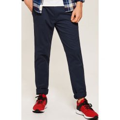 Spodnie typu chino - Granatowy. Niebieskie eleganckie spodnie męskie House. Za 99.99 zł.