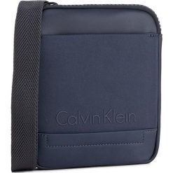 Saszetka CALVIN KLEIN - Caillou Mini Flat Cr K50K502829 422. Saszetki męskie marki Calvin Klein. W wyprzedaży za 209.00 zł.