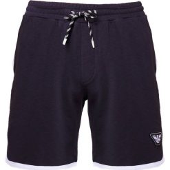 Emporio Armani Spodnie treningowe blue navy. Spodnie dresowe męskie marki Emporio Armani. W wyprzedaży za 554.25 zł.