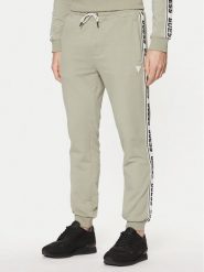 Guess Spodnie dresowe Z2YB19 K6ZS1 Zielony Regular Fit. Zielone spodnie dresowe męskie Guess, z aplikacjami, z bawełny. Za 299.99 zł.