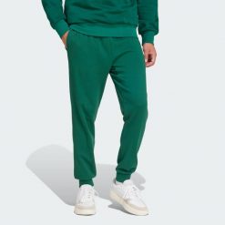 Spodnie Essentials Feel Cozy French Terry. Czarne spodnie dresowe męskie ADIDAS, bez wzorów, z dresówki. W wyprzedaży za 164.25 zł.