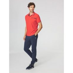 Koszulka polo męska TBS Selimpol. Czerwone koszulki polo męskie TBS, l, bez wzorów, sportowe, bez kołnierzyka, bez ramiączek. Za 319.00 zł.