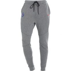 Nike Performance PARIS ST GERMAIN Artykuły klubowe carbon heather/rush red. Długie spodnie sportowe męskie marki Nike Performance. Za 379.00 zł.
