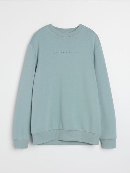 Bluza crewneck z napisem - niebieski. Niebieskie bluzy nierozpinane męskie Sinsay, l, bez wzorów, bez ramiączek, bez kaptura. Za 39.99 zł.