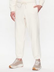 New Balance Spodnie dresowe MP23551 Écru Relaxed Fit. Spodnie dresowe męskie New Balance, bez wzorów, z bawełny. Za 279.99 zł.
