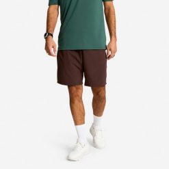 Spodenki fitness cardio męskie Domyos. Brązowe szorty sportowe męskie DOMYOS, bez wzorów, z materiału, sportowe. Za 79.99 zł.