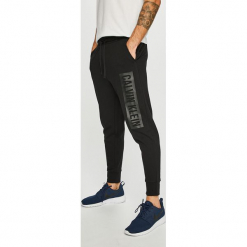Calvin Klein Performance - Spodnie. Szare spodnie dresowe męskie marki Calvin Klein Performance, z nadrukiem, z bawełny. Za 299.90 zł.