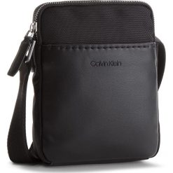 Saszetka CALVIN KLEIN - Multi Task Mini Repo K50K503782 001. Saszetki męskie marki Calvin Klein. Za 299.00 zł.
