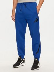 Adidas Spodnie dresowe Z.N.E. JF6541 Niebieski Regular Fit. Niebieskie spodnie dresowe męskie ADIDAS, bez wzorów, z bawełny. Za 249.99 zł.