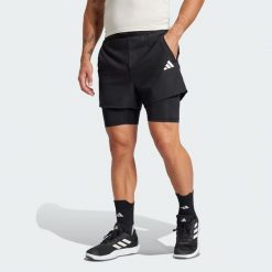 Szorty Gym+ 2-in-1. Czarne szorty sportowe męskie ADIDAS, bez wzorów, z materiału, sportowe. Za 249.00 zł.