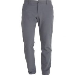 Under Armour SHOWDOWN TAPER PANT Spodnie materiałowe rhino gray. Długie spodnie sportowe męskie Under Armour. Za 399.00 zł.