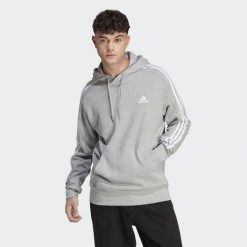 Bluza z kapturem adidas 3-Stripes Essentials French Terry. Białe bluzy nierozpinane męskie ADIDAS, m, bez wzorów, bez ramiączek, z kapturem. Za 225.00 zł.