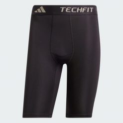 Krótkie kompresyjne legginsy treningowe TECHFIT. Czarne buty treningowe męskie ADIDAS, bez wzorów, z materiału, sportowe. Za 129.00 zł.