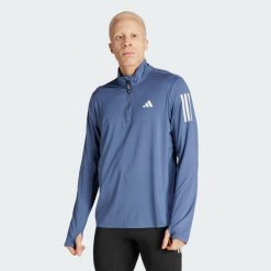 Kurtka Own the Run Half-Zip. Niebieskie kurtki męskie ADIDAS, xl, bez wzorów, sportowe, bez ramiączek, bez kaptura. Za 129.99 zł.