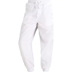 Calvin Klein Jeans GONIS Spodnie treningowe bright white. Długie spodnie sportowe męskie Calvin Klein Jeans. Za 549.00 zł.