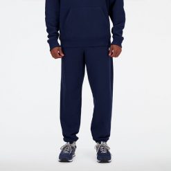 Spodnie męskie New Balance MP41519NNY – granatowe. Niebieskie spodnie dresowe męskie New Balance, bez wzorów, z bawełny. Za 249.99 zł.