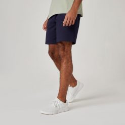 Spodenki fitness męskie Domyos 500 Essentials. Niebieskie szorty sportowe męskie DOMYOS, bez wzorów, z bawełny, sportowe. Za 49.99 zł.
