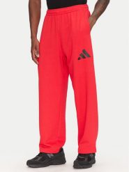 Adidas Spodnie dresowe Essentials JF3601 Czerwony Loose Fit. Czerwone spodnie dresowe męskie ADIDAS, bez wzorów, z bawełny. Za 139.99 zł.