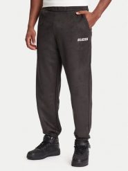 Guess Spodnie dresowe Z5YB03 KCJY2 Zielony Regular Fit. Zielone spodnie dresowe męskie Guess, z aplikacjami, z bawełny. Za 309.99 zł.