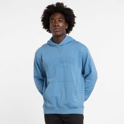 Bluza męska New Balance MT43500HEB – niebieska. Niebieskie bluzy nierozpinane męskie New Balance, l, z aplikacjami, z bawełny, klasyczne, bez ramiączek, z kapturem. Za 199.99 zł.