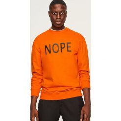 Bluza z aplikacją Nope - Pomarańczo. Pomarańczowe bluzy nierozpinane męskie Reserved, z aplikacjami. Za 99.99 zł.