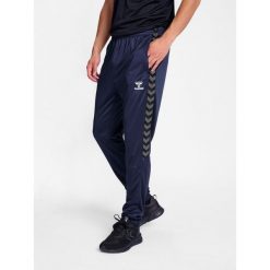 Spodnie dresowe treningowe Hummel Authentic. Niebieskie spodnie dresowe męskie HUMMEL, bez wzorów, z dresówki. Za 193.50 zł.