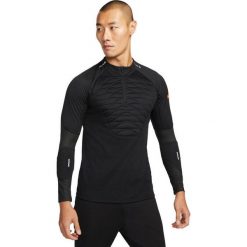 Bluza treningowa męska Nike Techfit Strike Drill Top Winter Warrior. Czarne bluzy nierozpinane męskie Nike, m, bez wzorów, bez ramiączek, bez kaptura. W wyprzedaży za 170.15 zł.