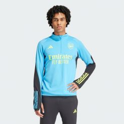 Bluza piłkarska męska Adidas Arsenal Tiro 23 Training. Niebieskie bluzy nierozpinane męskie ADIDAS, m, bez wzorów, sportowe, bez ramiączek, bez kaptura. W wyprzedaży za 270.55 zł.
