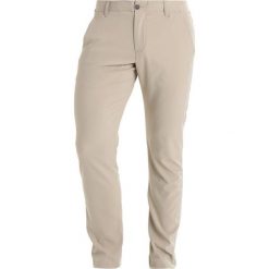 Under Armour TAKEOVER GOLF PANT TAPER Spodnie materiałowe city khaki. Długie spodnie sportowe męskie marki Under Armour. Za 359.00 zł.