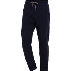 Tommy Jeans ESSENTIAL Spodnie treningowe dark blue. Długie spodnie sportowe męskie Tommy Jeans. Za 349.00 zł.