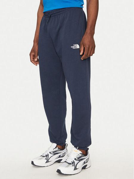 The North Face Spodnie dresowe Simple Dome Light NF0A8C41 Granatowy Regular Fit. Niebieskie spodnie dresowe męskie The North Face, bez wzorów, z bawełny. Za 229.99 zł.