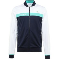 Lacoste Sport TENNIS JACKET Kurtka sportowa white/navy blue/papeete. Kurtki treningowe męskie marki Lacoste Sport. Za 499.00 zł.
