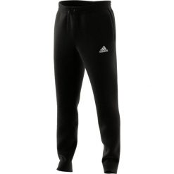 Spodnie męskie adidas Essentials Tapered Cuff Pants. Białe spodnie dresowe męskie ADIDAS, bez wzorów. Za 129.00 zł.