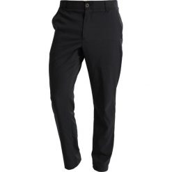 Under Armour TAKEOVER GOLF PANT TAPER Spodnie materiałowe black. Długie spodnie sportowe męskie marki Under Armour. Za 359.00 zł.