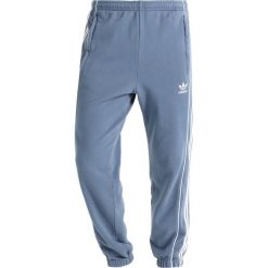 Adidas Originals PIPE Spodnie treningowe rawste/white. Długie spodnie sportowe męskie Adidas Originals. Za 359.00 zł.