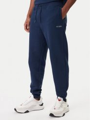 Guess Spodnie dresowe Z6RB12 KAIJ1 Granatowy Regular Fit. Niebieskie spodnie dresowe męskie Guess, z aplikacjami, z bawełny. Za 299.99 zł.