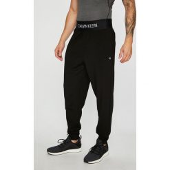Calvin Klein Performance - Spodnie. Szare spodnie dresowe męskie Calvin Klein Performance, z dzianiny. Za 349.90 zł.