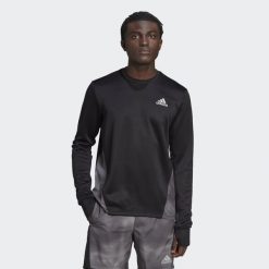 Bluza z blokami kolorów adidas Own the Run. Czarne bluzy nierozpinane męskie ADIDAS, s, bez wzorów, sportowe, bez ramiączek, bez kaptura. W wyprzedaży za 160.60 zł.