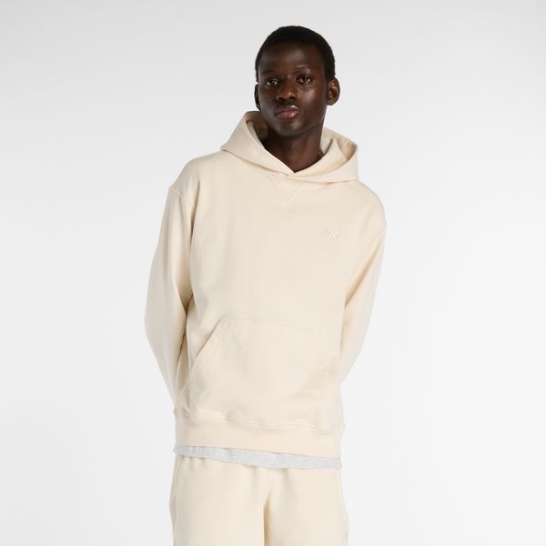 Bluza męska New Balance MT41534PEF – beżowa. Brązowe bluzy z kapturem męskie New Balance, l, bez wzorów, z materiału, z kapturem. Za 399.99 zł.