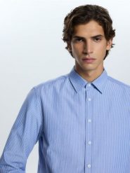 Koszula regular fit w paski - jasnoniebieski. Niebieskie koszule męskie Reserved, l, bez wzorów, z bawełny, bez kołnierzyka, bez ramiączek. Za 129.99 zł.