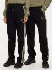 Ellesse Spodnie dresowe Unisex Nioro SHX21064 Czarny Regular Fit. Czarne spodnie dresowe męskie Ellesse, bez wzorów, z bawełny. Za 179.99 zł.