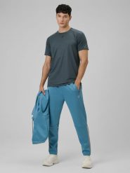 4F Spodnie treningowe szybkoschnące męskie - granatowe XXL. Niebieskie długie spodnie sportowe męskie 4f, bez wzorów, ze skóry. Za 179.99 zł.