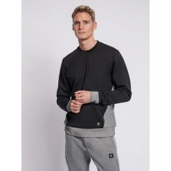 Bluza Hummel Tropper. Czarne bluzy nierozpinane męskie HUMMEL, l, bez wzorów, sportowe, bez ramiączek, bez kaptura. Za 204.00 zł.