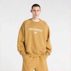 Bluza męska New Balance MT61U4JOABG – pomarańczowa. Brązowe bluzy nierozpinane męskie New Balance, m, bez wzorów, z bawełny, eleganckie, bez ramiączek, bez kaptura. Za 279.99 zł.