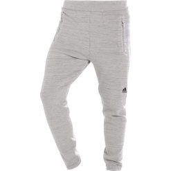 Adidas Performance Spodnie treningowe chapea. Brązowe spodnie dresowe męskie adidas Performance, z elastanu, długie. W wyprzedaży za 359.10 zł.