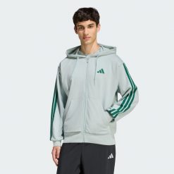 Bluza z kapturem Essentials 3-Stripes French Terry Full-Zip. Zielone bluzy nierozpinane męskie ADIDAS, bez wzorów, z materiału, bez ramiączek, z kapturem. Za 279.00 zł.