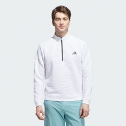Zakładana przez głowę bluza Ultimate365 Dwr Textured Quarter Zip. Białe bluzy nierozpinane męskie ADIDAS, bez wzorów, z materiału, sportowe, bez ramiączek, bez kaptura. Za 349.00 zł.